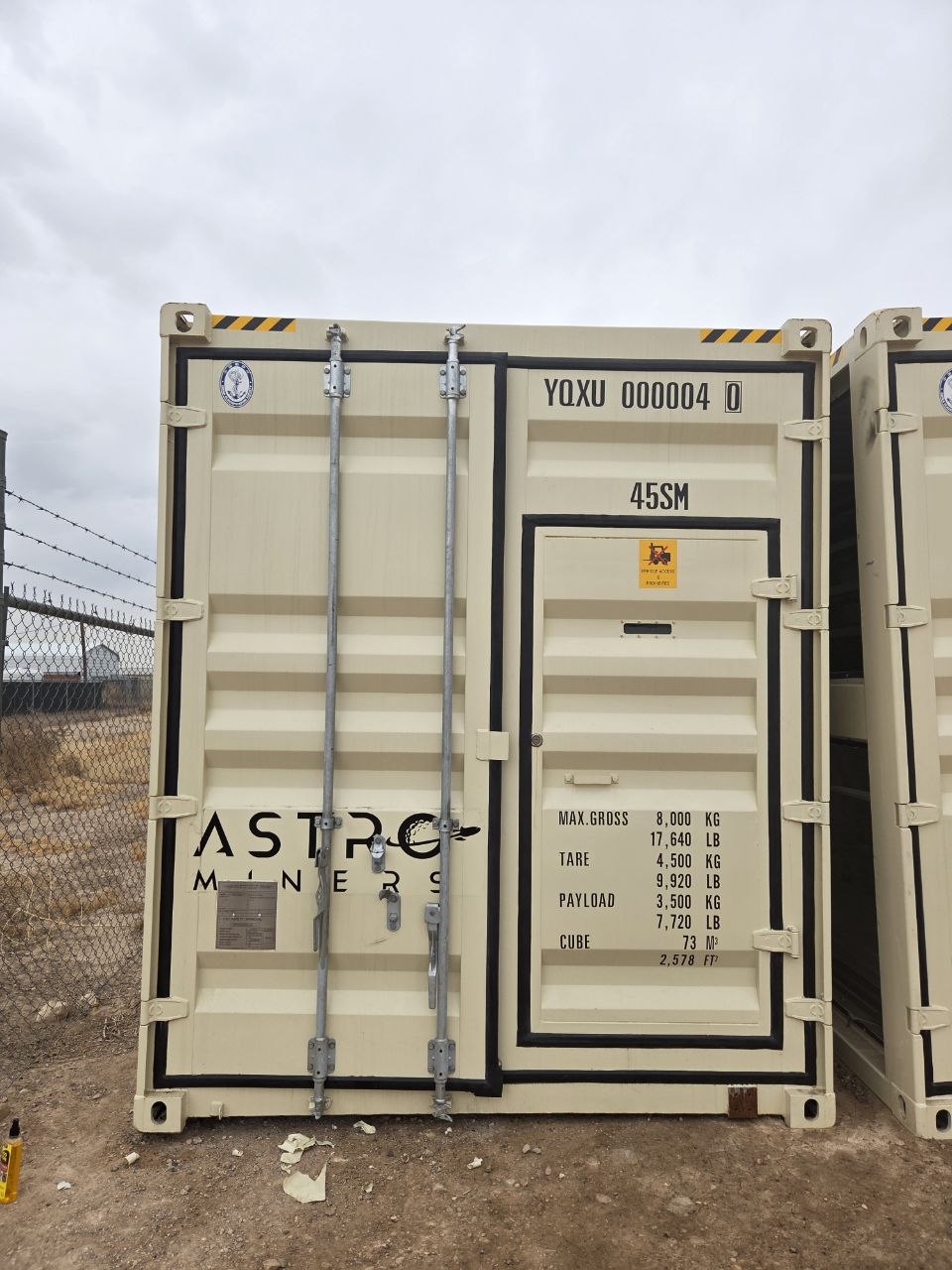 Astro Miners branded container door at the Odessa Texas facility
